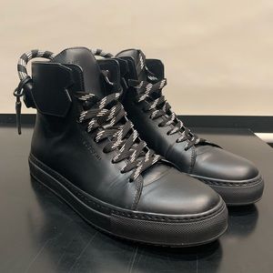 Buscemi Black and white silver buckle sneakers.